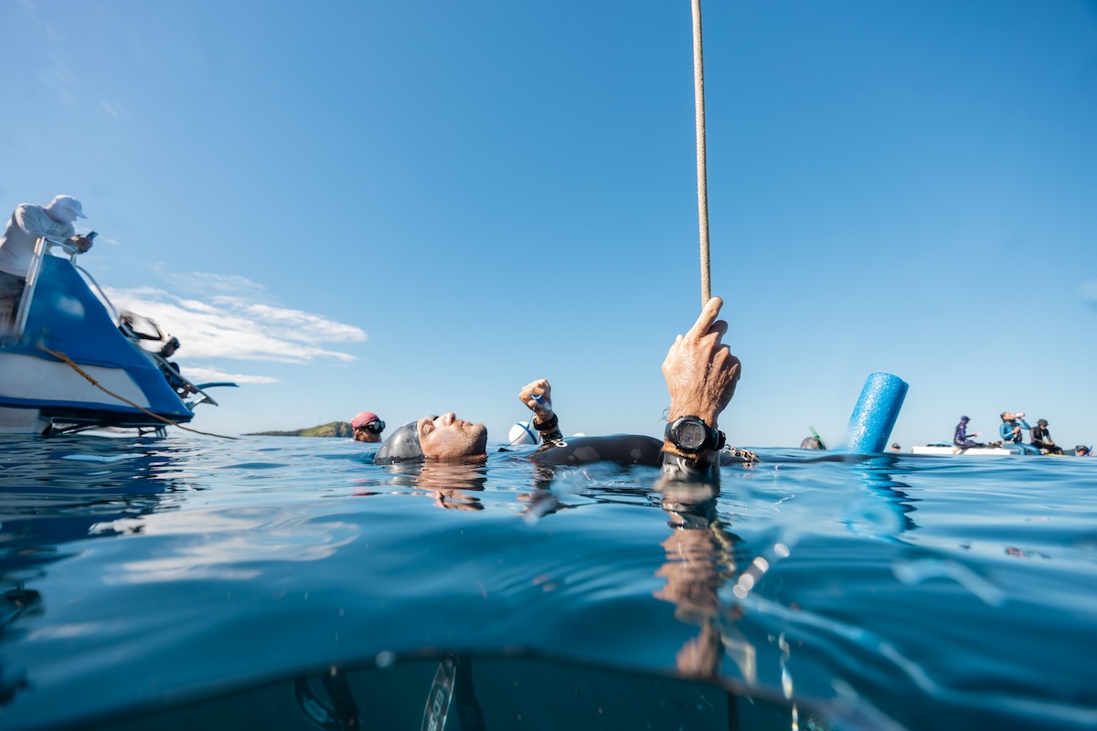 Harry McCahill floating on his back at the surface, breathing up before a dive