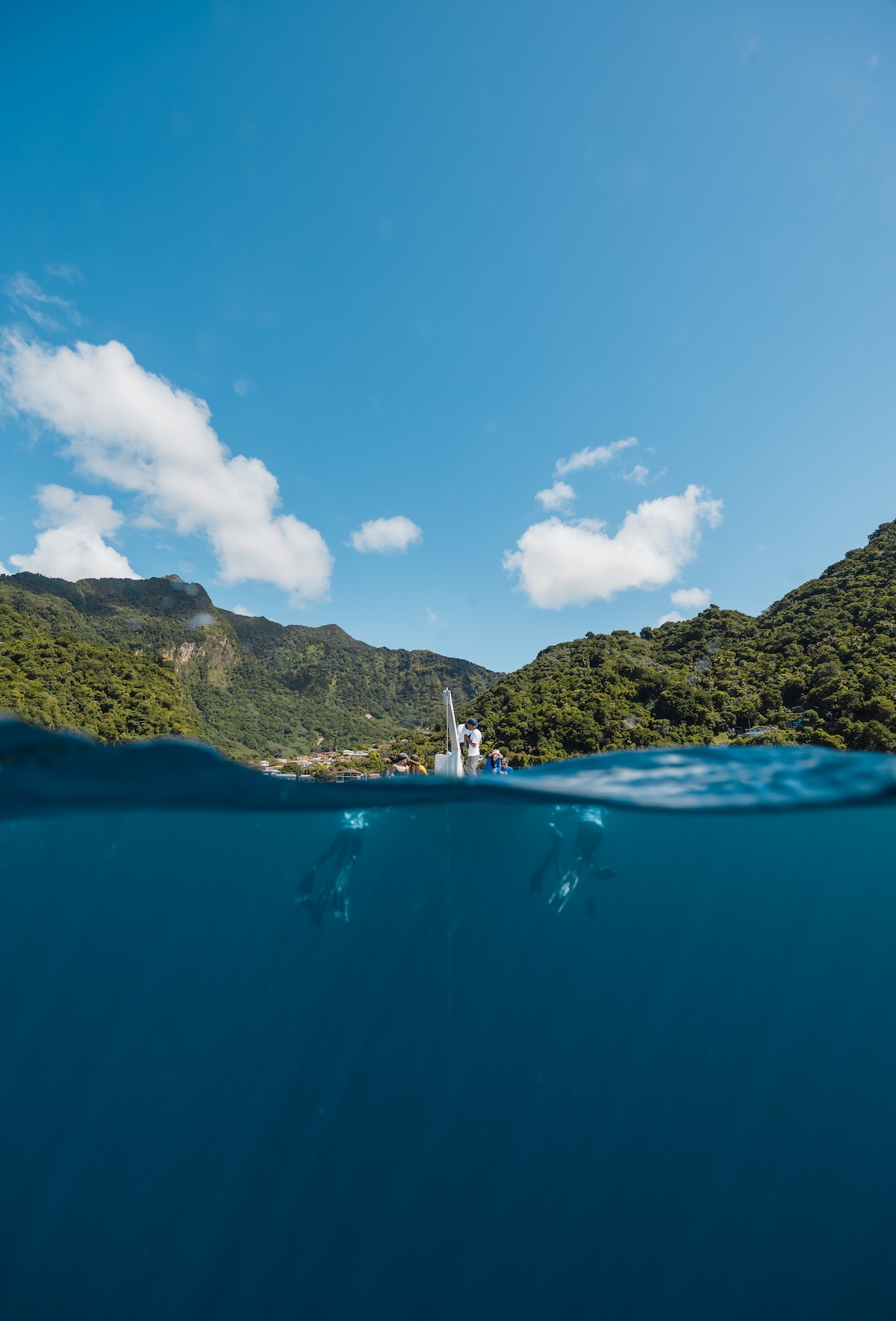 Over-under split shot of Soufrière Bay, Dominica